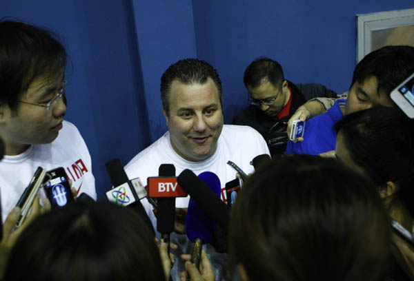 Basketball team trains while Yao Ming watches