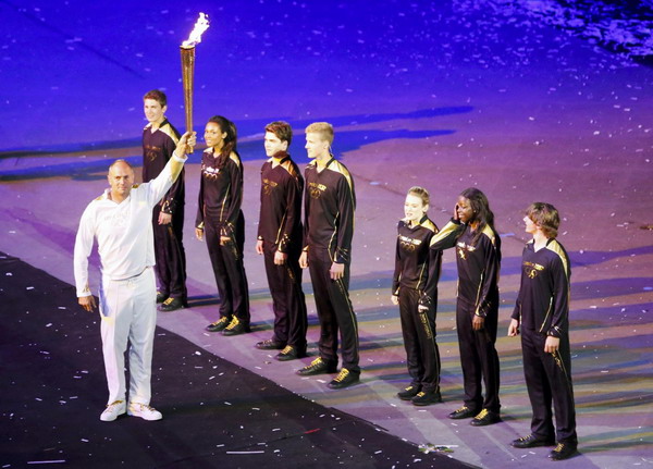 Seven teenagers light Olympic cauldron