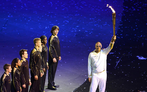 Seven teenagers light Olympic cauldron