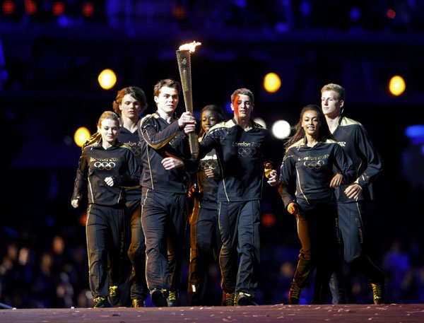 Seven teenagers light Olympic cauldron