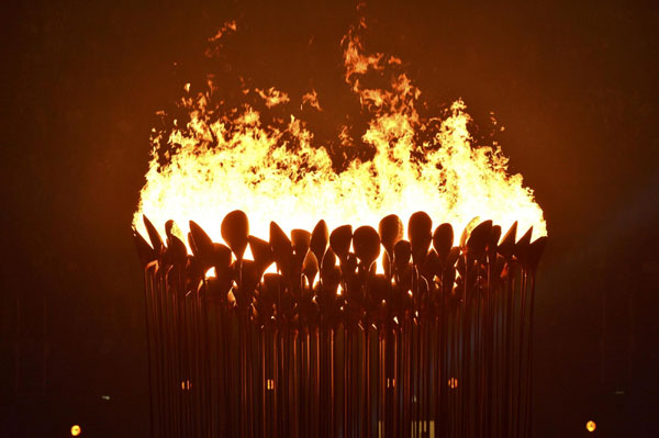 Seven teenagers light Olympic cauldron