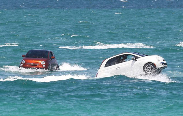 Fiat cars swimming off coast