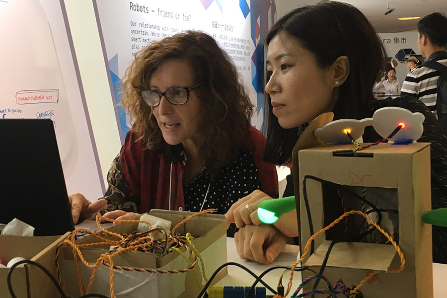 Participants try their hands on making robots at Summer Davos