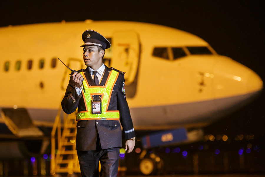 Behind an airport: Obscure people carrying out their duties