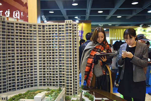 More Chinese cities restrict house purchases