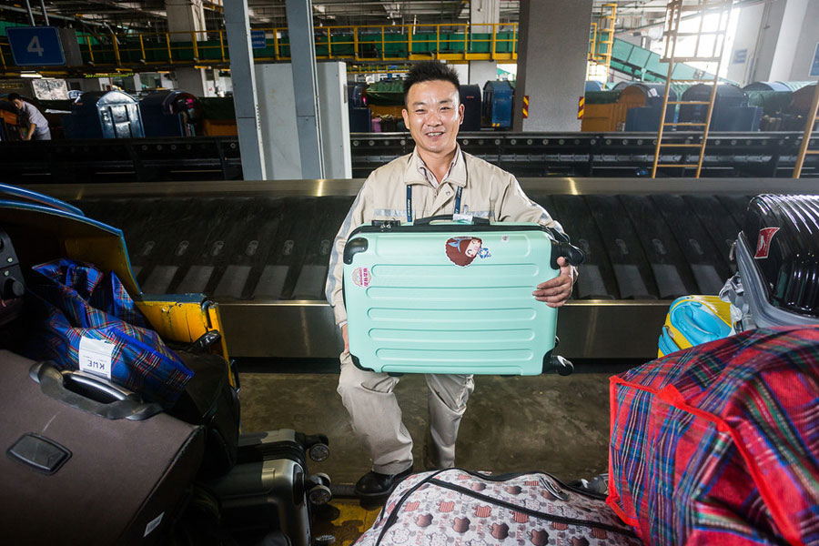 Behind an airport: Obscure people carrying out their duties