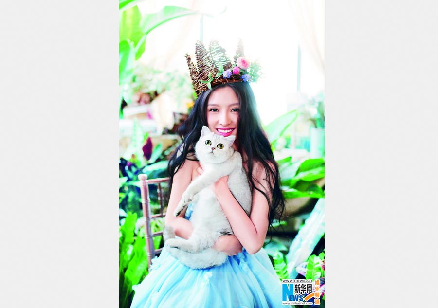 Pan Chen poses for <EM>Cat Fans</EM> magazine