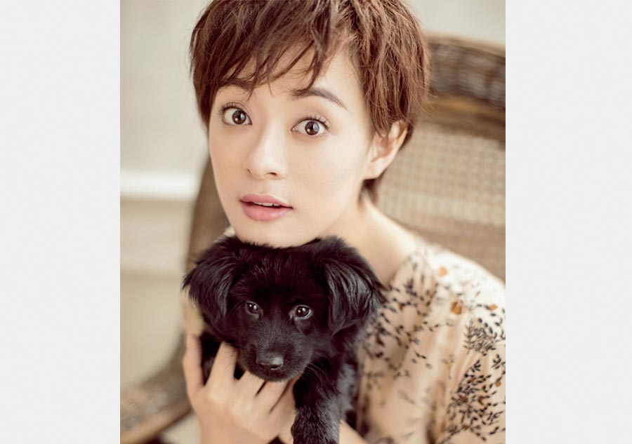 Sun Li poses with dogs for fashion magazine