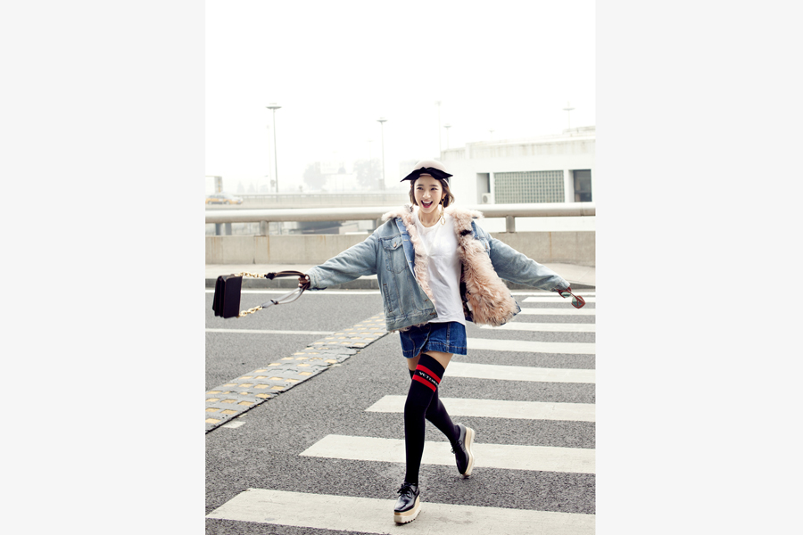 Actress Tang Yixin poses for street style photos