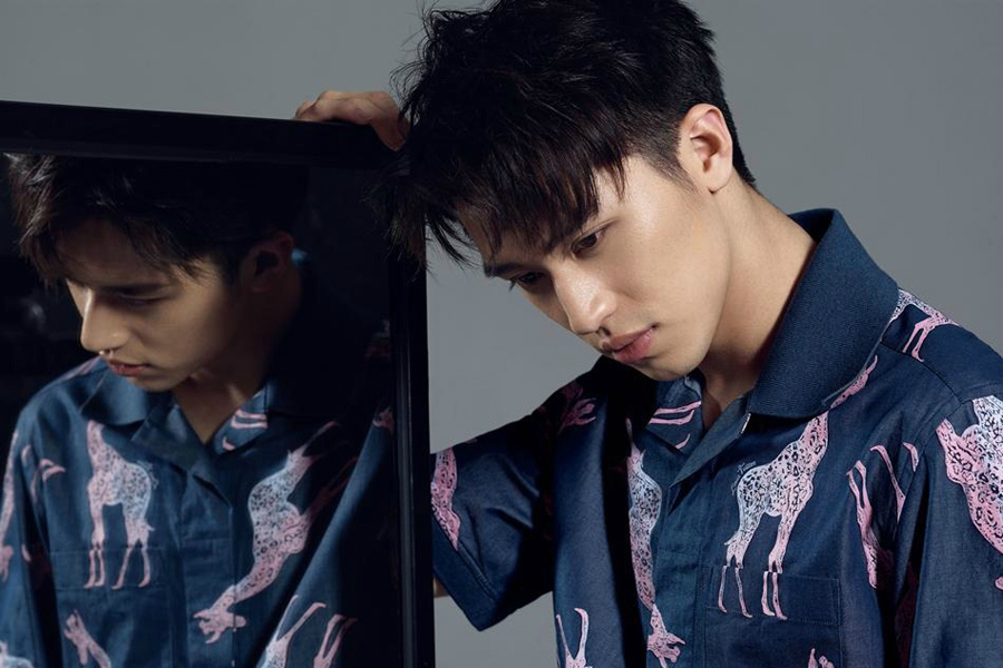 Actor Xu Weizhou poses for fashion magazine