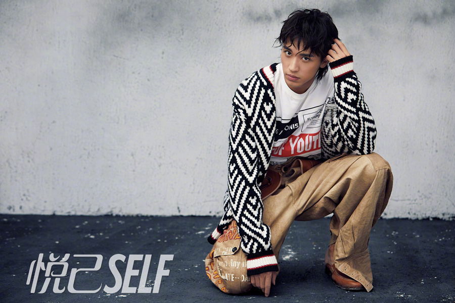 Actor Xu Weizhou poses for fashion magazine