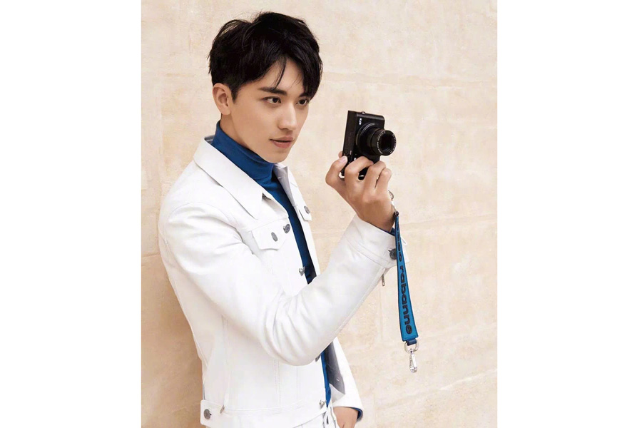 Actor Xu Weizhou poses for fashion magazine