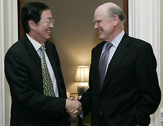 U.S. Treasury Secretary John Snow (R) meets Central Bank Governor of China Zhou Xiaochuan in Washington April 20, 2006.