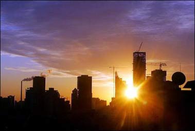 Skyscrapers rise above Beijing as the morning sun rises. The World Bank unveiled an ambitious plan of lending to China that highlights environmental destruction and social inequality as "critical" challenges for the booming nation.(