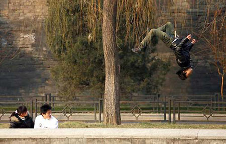 A parkour fan practices at a park near the Forbidden City in Beijing. [Photo: China Photo Press]