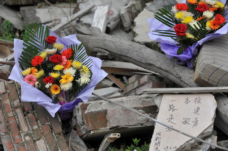 China opens quake-leveled county to mourners