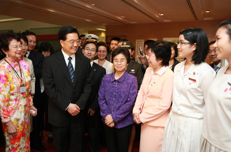 Hu visits school, plant in Singapore