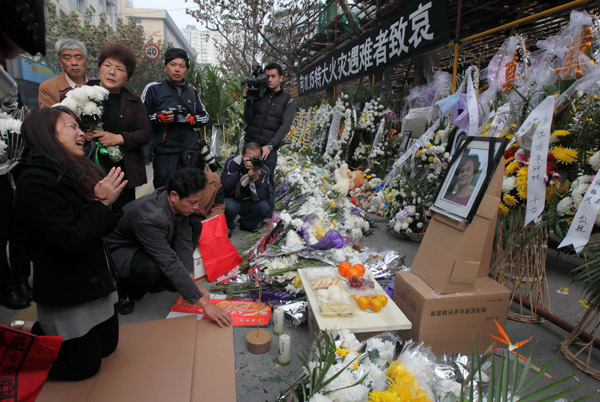 Thousands mourn inferno victims