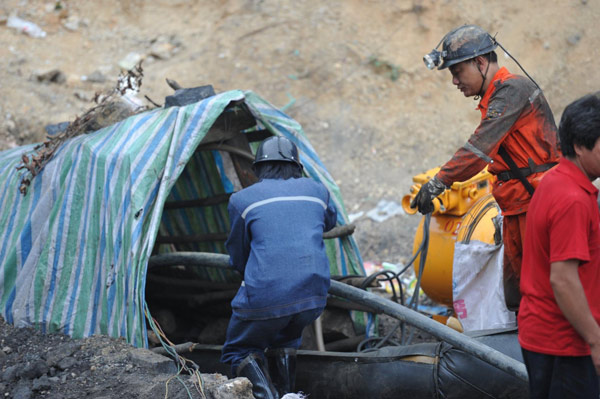 2 dead, 18 still missing in flooded coal mines