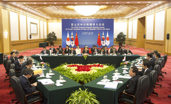 Trilateral meeting kicks off in Beijing