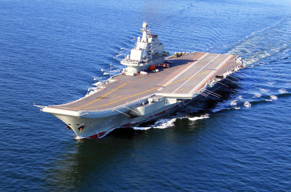 China conducts flight landing on aircraft carrier