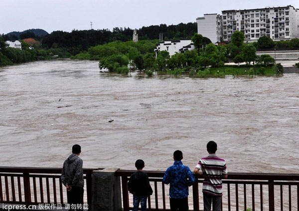 E. China downpours cause heavy damage