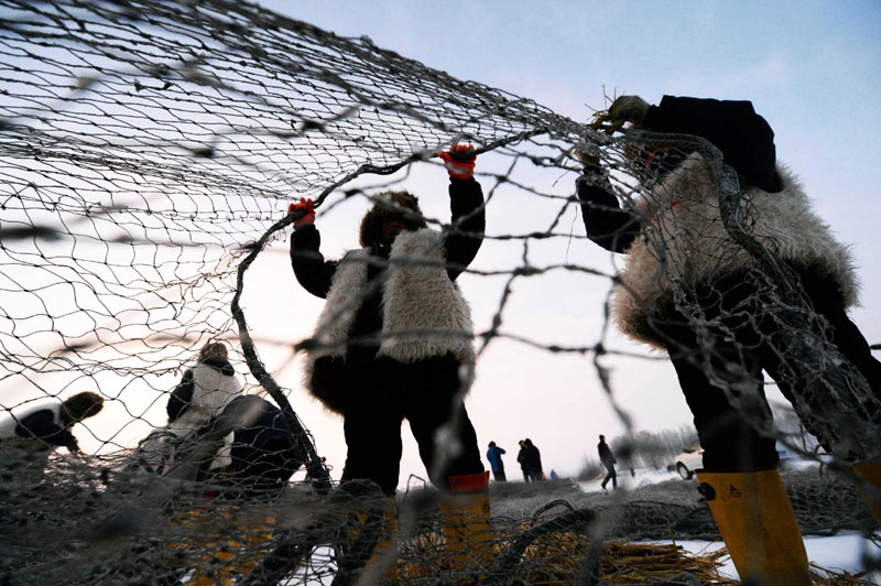 Ancient fishing ritual held on frozen river