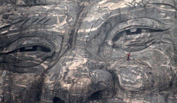 'Spiderwoman' faints after cleaning huge stone carving