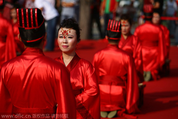 Couples tie the knot in traditional group wedding