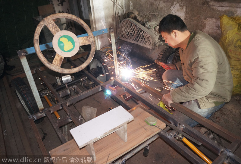 Carpenter carves armored vehicle from wood