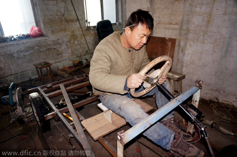 Carpenter carves armored vehicle from wood