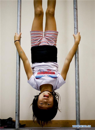 Chinese girl in local Spanish human tower team