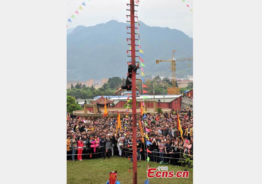 Climbing a ladder of knives to mark Double Third Day festival