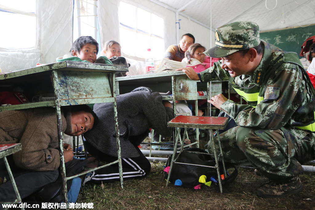 Earthquake relief soldiers have a lighter moment with kids