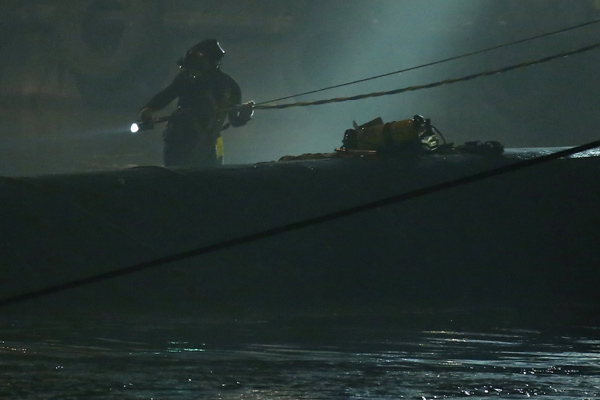 Rescuers fight bad weather at night