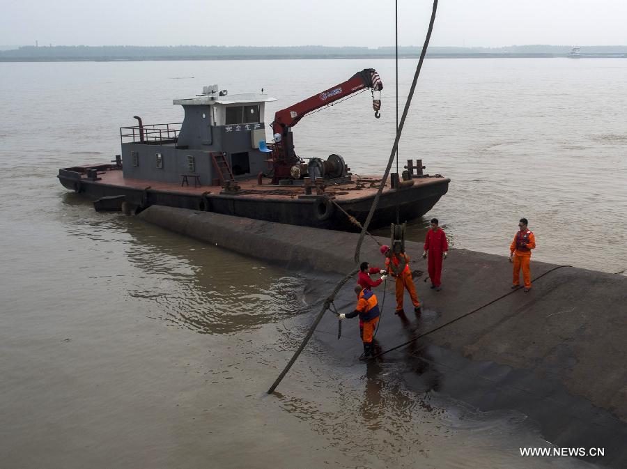 Rescuers cut into capsized ship in search for survivors