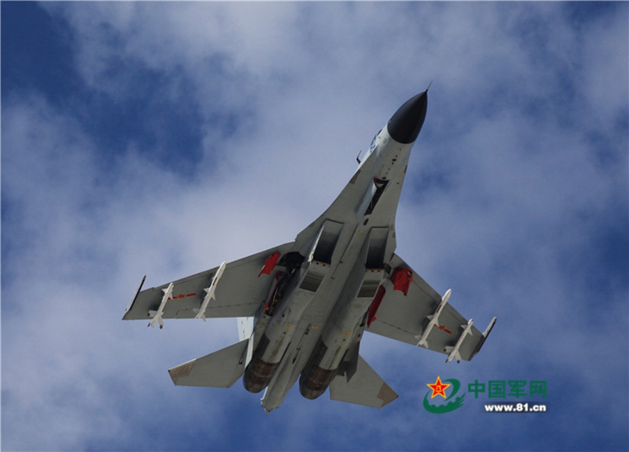 Naval aviation J-11 fighters conduct flight training