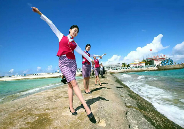 Chinese stewardess celebrate test flight at Nansha Islands airfield