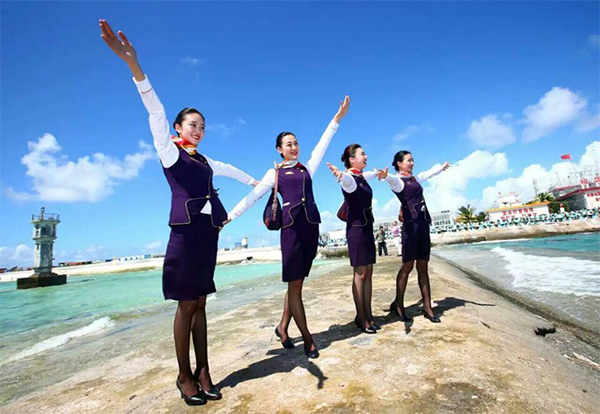 Chinese stewardess celebrate test flight at Nansha Islands airfield