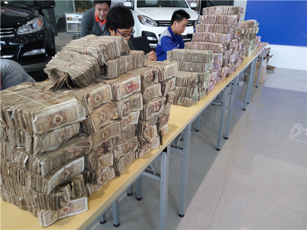 Man buys new car with a vehicle full of change