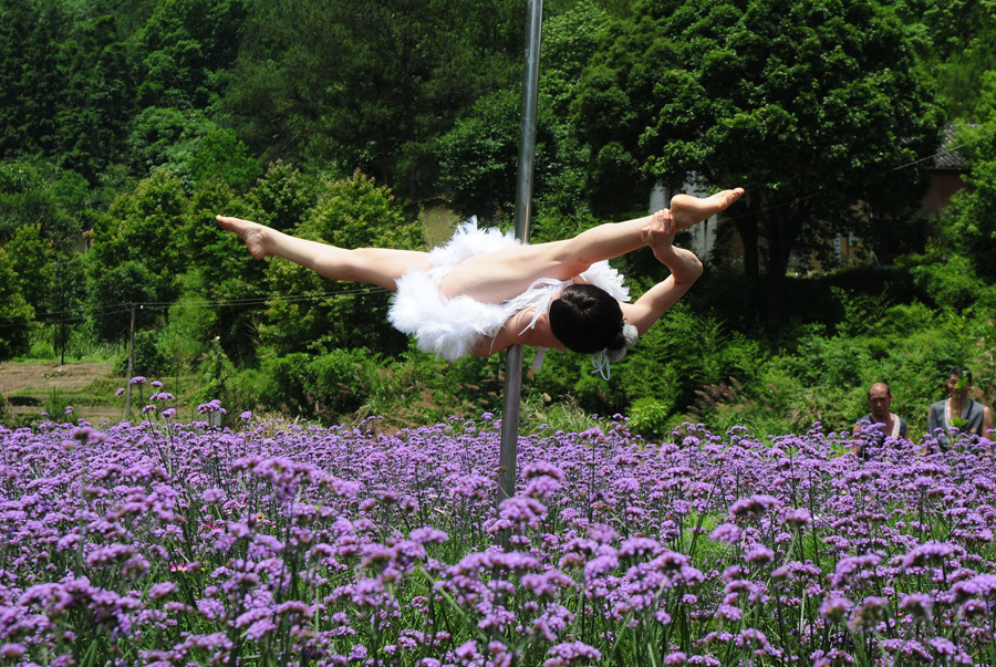 Pole dancing in sea of flowers