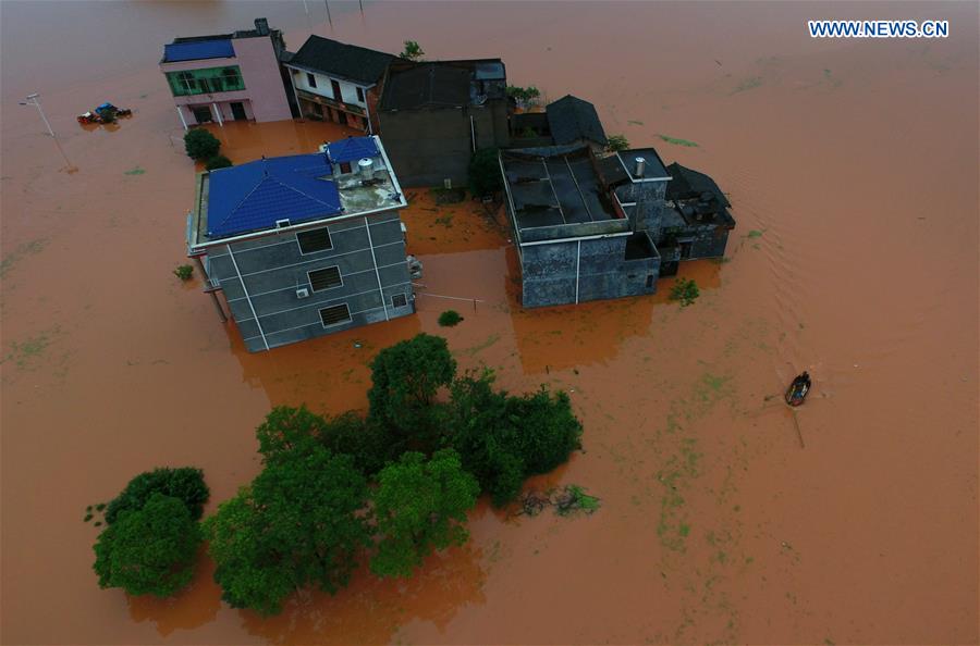 13 dead, 13 missing in China rain, landslides