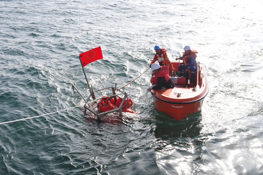 Staff practice submersible Rainbow Fish on research vessel in S. China Sea