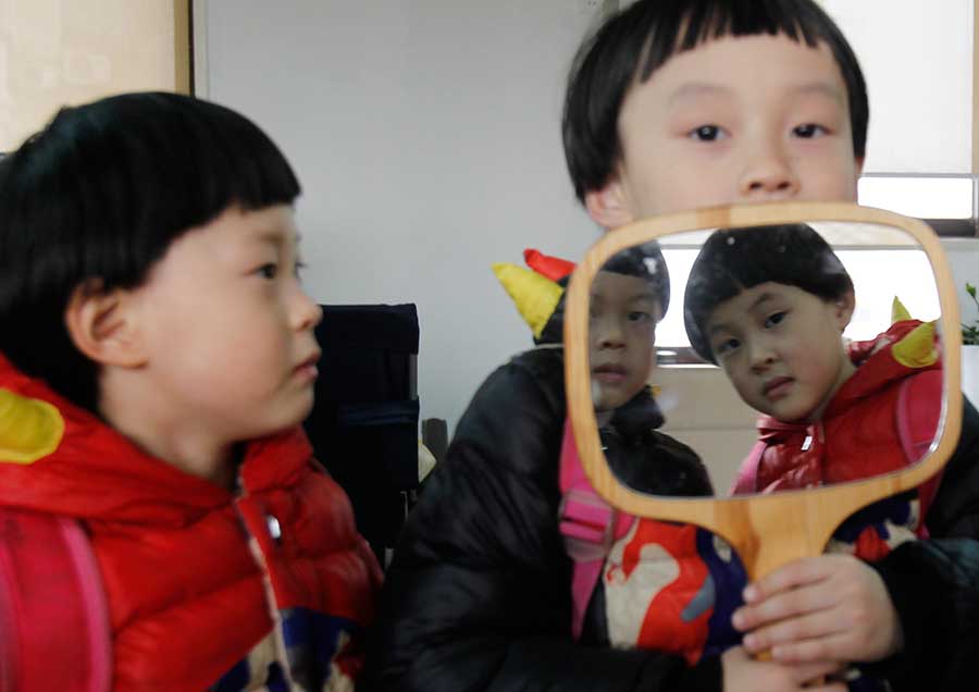 Four of a kind: Quadruplets get ready for school in Changsha