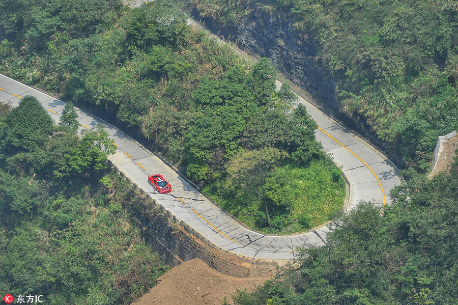 Italian sets new record with Ferrari on China's 'miracle road'