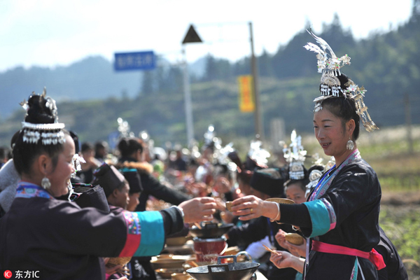 Dong people eat at world's longest feast table