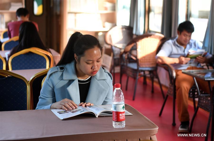 Retired green train transforms into 24-hour book bar