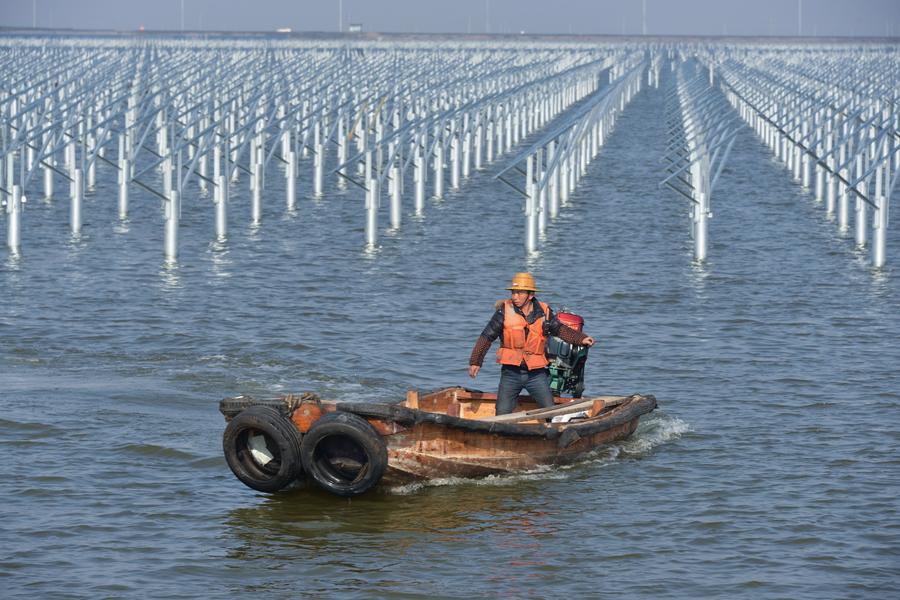 Solar power project under construction above fishery water