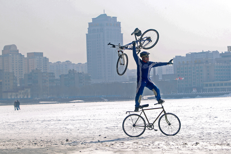 55-year-old man performs bicycle stunts on ice