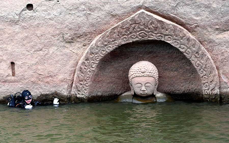 Ancient Buddha found as water level of reservoir lowers in E China